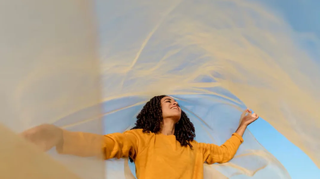 freedom-concept-with-woman-holding-cloth-nature_23-2148170212
